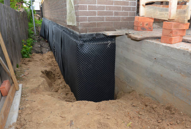 Happy homeowners after waterproofing job in Derby